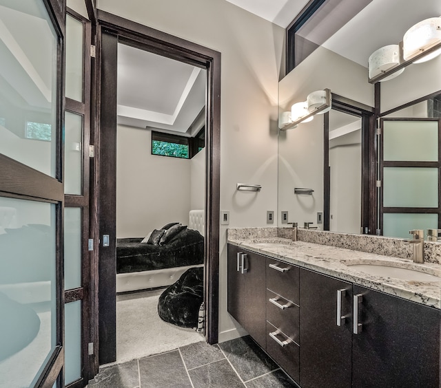 bathroom with vanity and tile patterned flooring