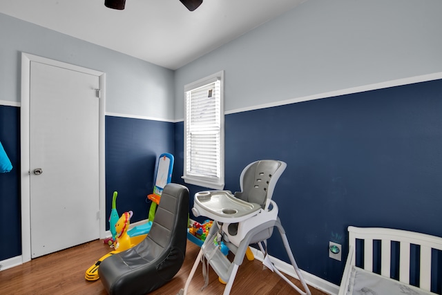 bedroom featuring wood-type flooring and ceiling fan