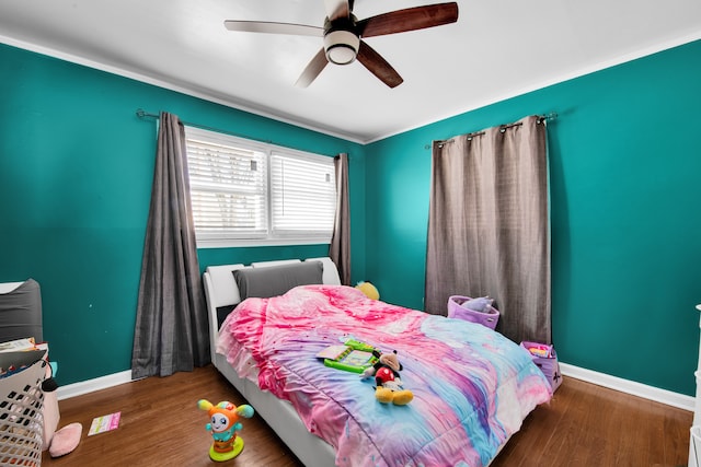 bedroom featuring dark hardwood / wood-style flooring and ceiling fan