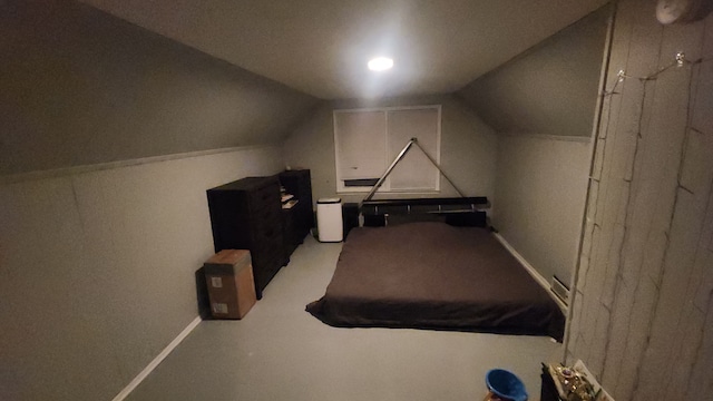 carpeted bedroom featuring vaulted ceiling