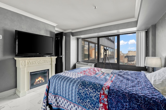 bedroom with ornamental molding and a wall unit AC