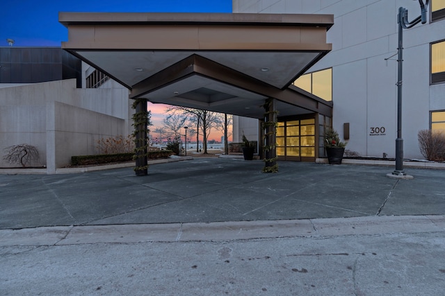 view of parking at dusk