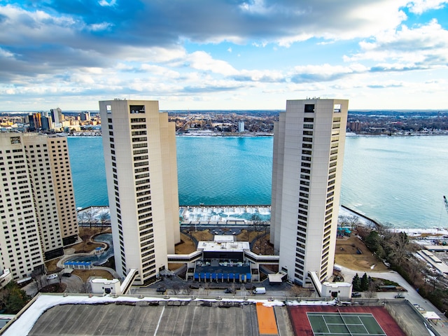 birds eye view of property with a water view