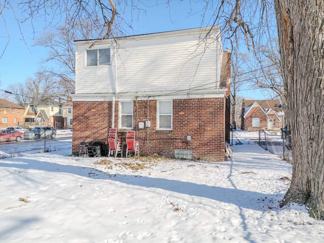 view of snow covered house