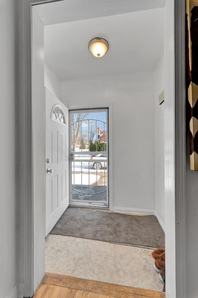 foyer with light hardwood / wood-style floors