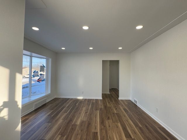 spare room featuring dark hardwood / wood-style flooring