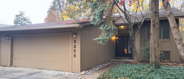 view of side of home featuring a garage