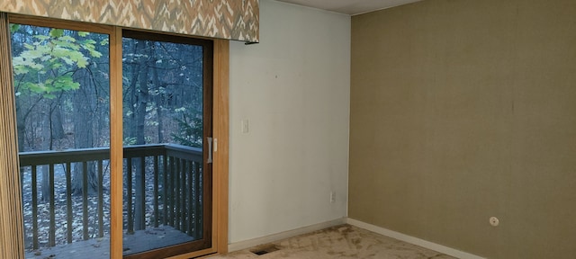 unfurnished room featuring visible vents and baseboards