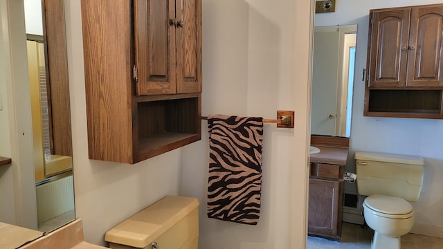 bathroom with toilet and vanity