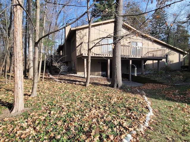 back of house featuring a deck