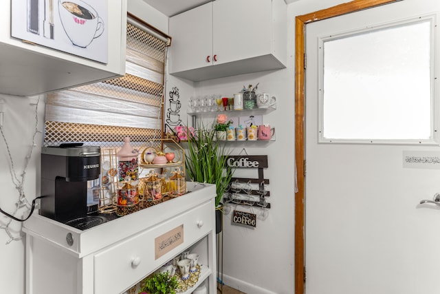 kitchen with white cabinetry and a wealth of natural light