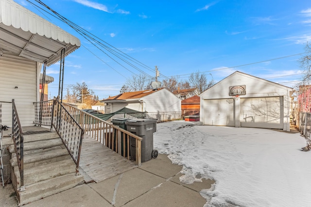 deck with an outbuilding and a garage