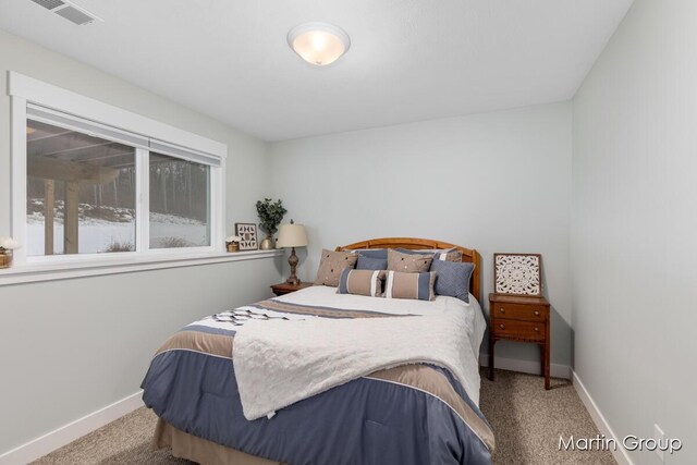 bedroom with visible vents, baseboards, and carpet flooring