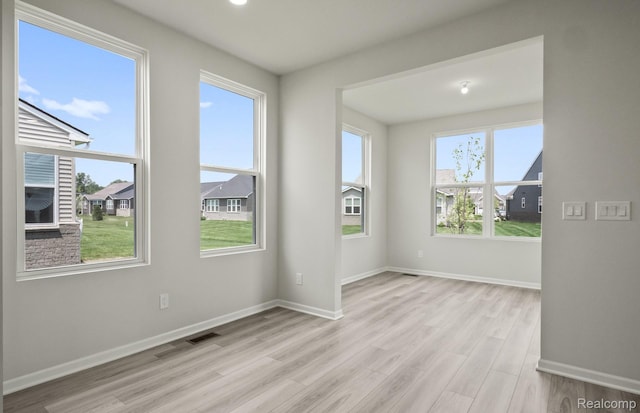 50050 Bluebell St, Canton, MI 48188 - spare room with wood finished floors and plenty of natural light