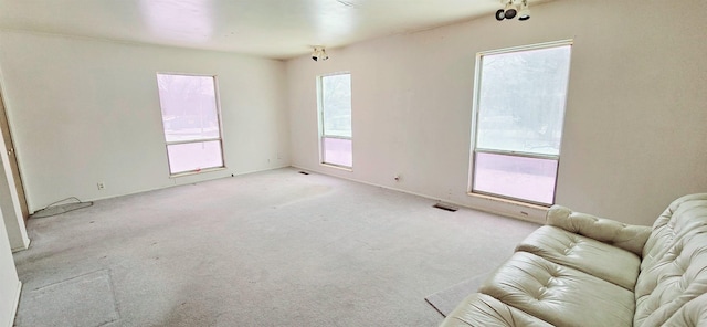 living area featuring light colored carpet