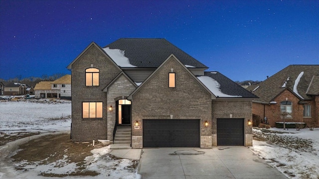 french country home featuring a garage