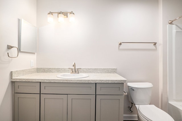 full bathroom featuring vanity, shower / tub combination, and toilet