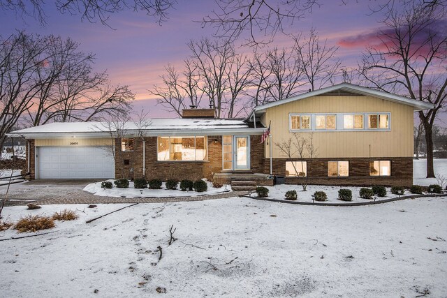 split level home featuring a garage