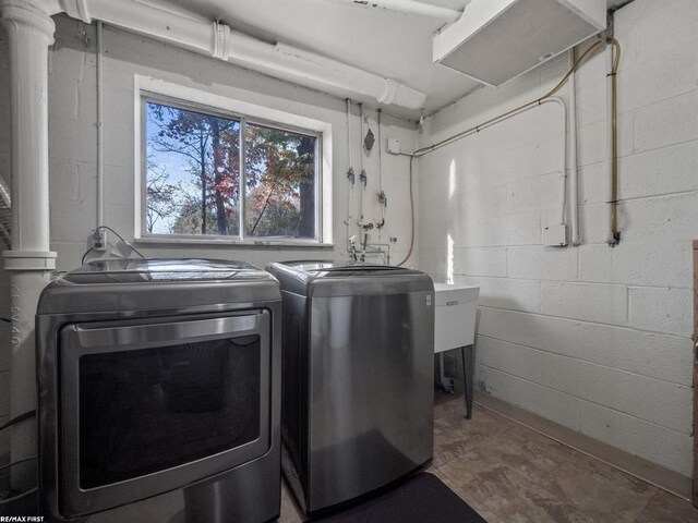 laundry room with separate washer and dryer