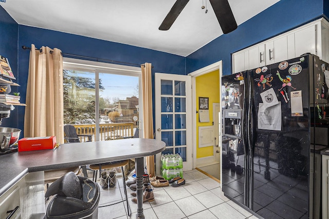 interior space with ceiling fan