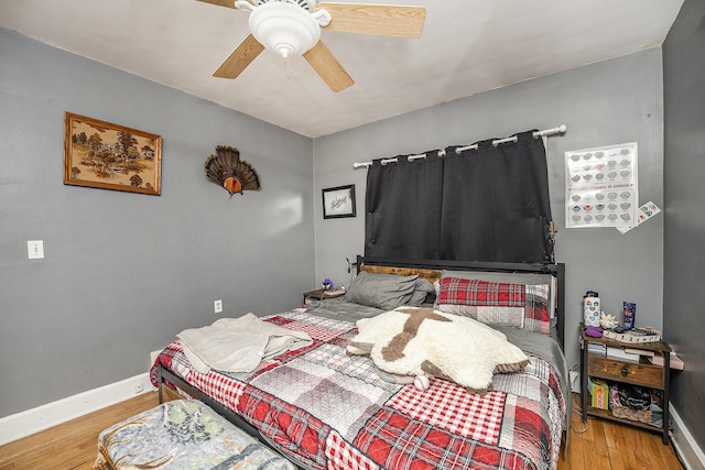 bedroom featuring wood-type flooring and ceiling fan