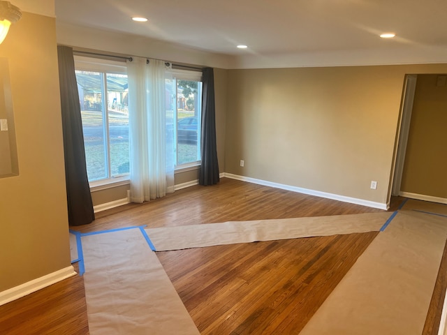 spare room with hardwood / wood-style flooring