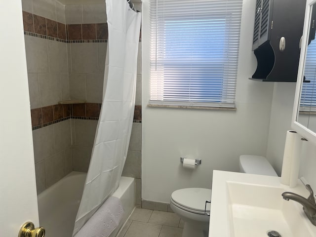 full bathroom with shower / tub combo, toilet, tile patterned flooring, and sink