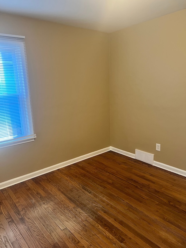 spare room featuring hardwood / wood-style floors