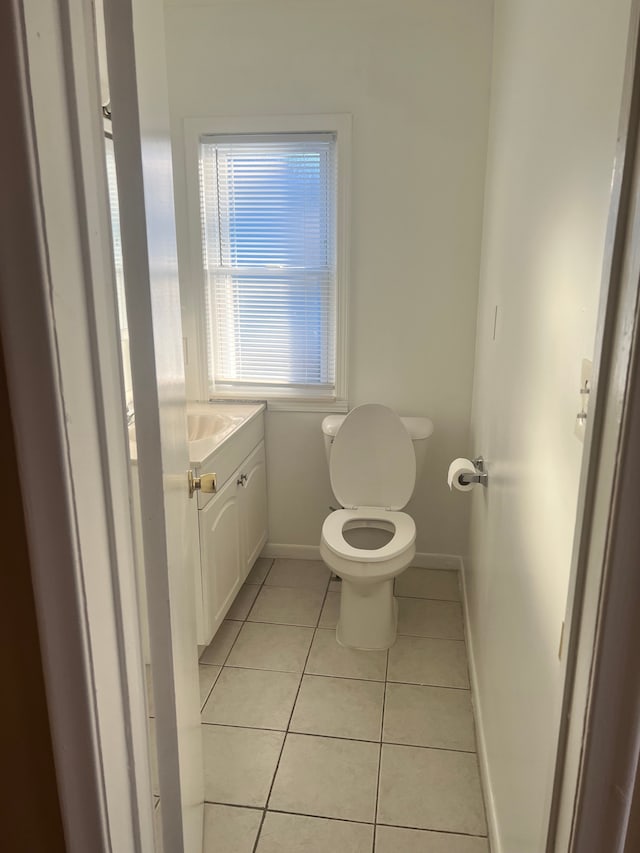 bathroom with tile patterned floors, toilet, and vanity