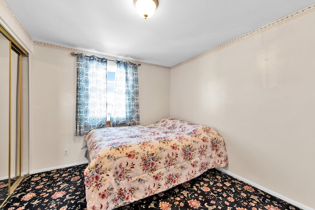 carpeted bedroom featuring a closet