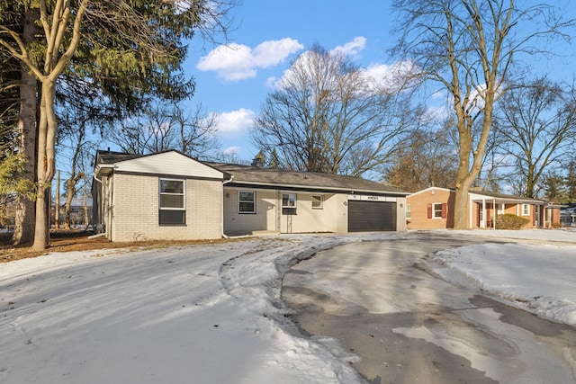 ranch-style house featuring a garage