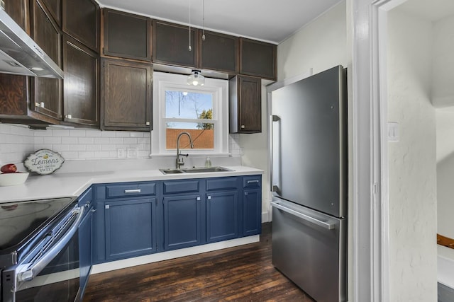 kitchen featuring wall chimney exhaust hood, sink, tasteful backsplash, appliances with stainless steel finishes, and dark hardwood / wood-style floors