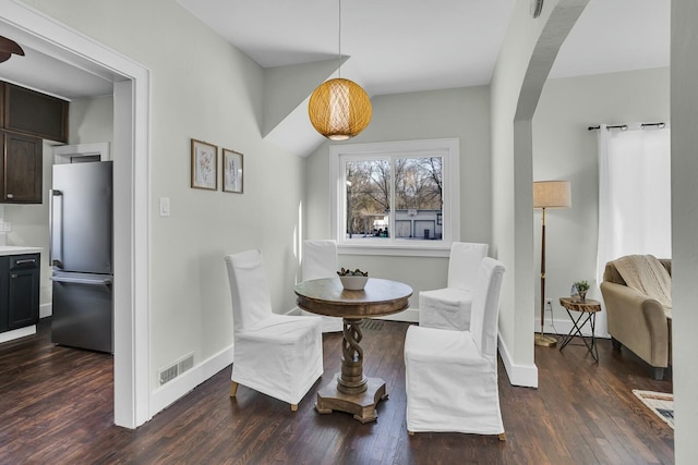 dining room with dark hardwood / wood-style floors