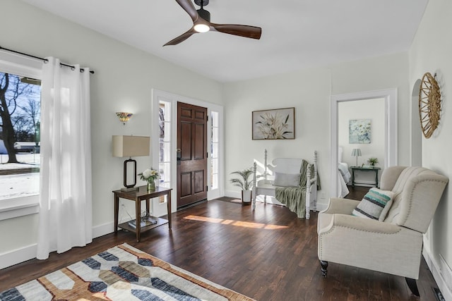 interior space with dark wood-type flooring, ceiling fan, and plenty of natural light