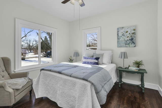 bedroom with ceiling fan and dark hardwood / wood-style flooring