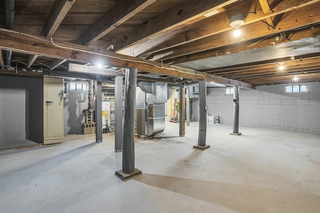 basement with heating unit and water heater