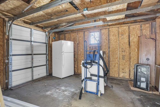 garage featuring white fridge