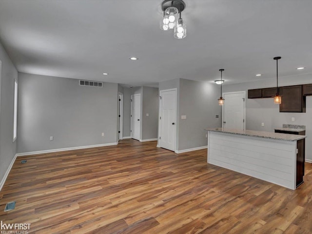 unfurnished living room with hardwood / wood-style floors