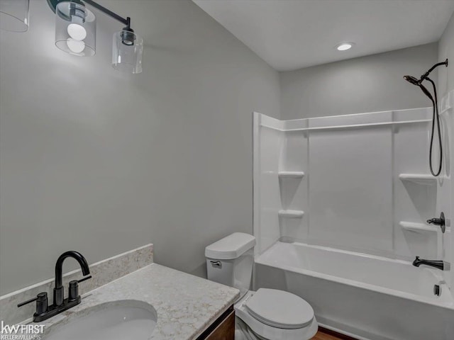 full bathroom with vanity, shower / bathtub combination, and toilet