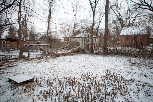 view of yard covered in snow