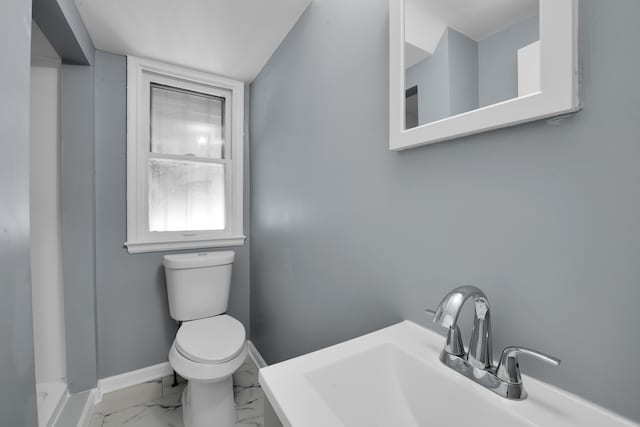 bathroom with sink and toilet