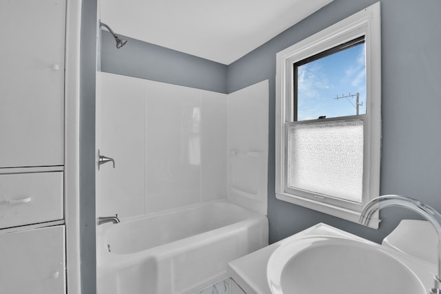 bathroom featuring shower / bathing tub combination and sink