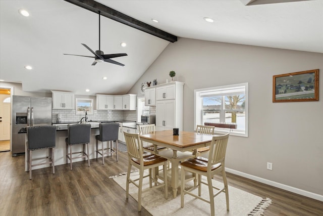 dining room featuring beamed ceiling, ceiling fan, dark hardwood / wood-style flooring, and high vaulted ceiling