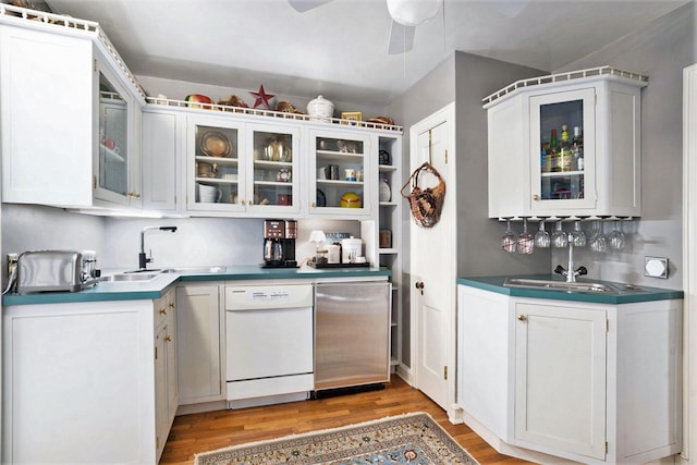 kitchen with white cabinetry, wood-type flooring, fridge, and dishwasher