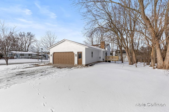 snow covered property featuring a deck