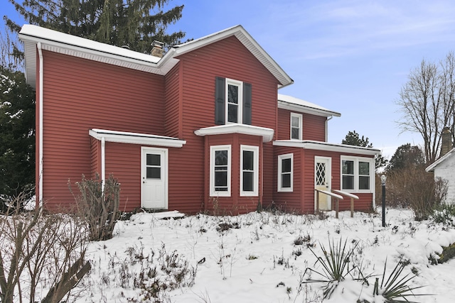 view of snow covered house