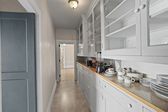 bar with white cabinetry