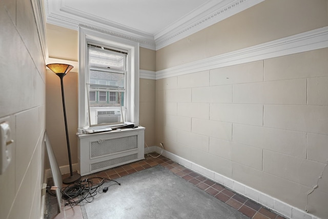 kitchen featuring crown molding, radiator, cooling unit, and dark tile patterned flooring