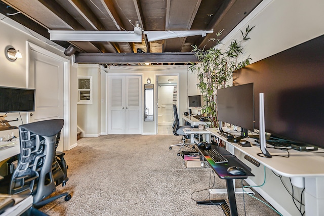 home office featuring carpet and baseboards