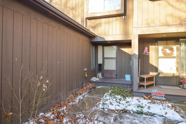 view of snow covered property entrance